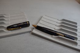 A Conway Stewart 15 leverfill fountain pen in blue/black marble with single band to cap having