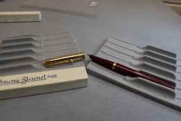 A boxed Conway Stewart Pressac fill fountain pen in red with gold cap. Approx 13.2cm
