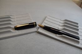 A Parker Victory button fill fountain pen in black with two bands to the cap having Parker 25 9 nib.