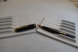 A Conway Stewart 28 leverfil fountain pen in black with single narrow band to the cap having a