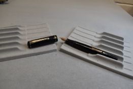 A Burnham No50 leverfill fountain pen in black with one broad band to the cap having a Burnham 14k