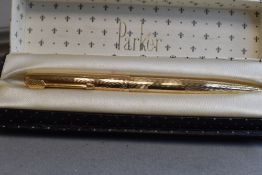 A Parker rolled gold ballpoint pen in original box