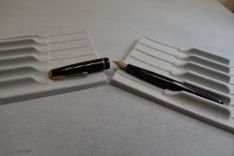 A Parker Slimfold fountain pen in black with single decorative band to cap with Parker 5 nib. Approx
