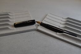 A Mabie Todd & Co Self filler leverfill fountain pen in black with chased design with Swan No1