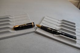 A Parker Duofold button fill fountain pen in black and grey marble having decorated band to cap with