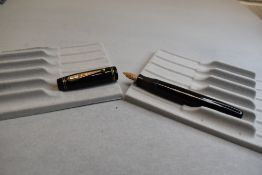 A Parco leverfill fountain pen in black with two narrow bands to base of the cap and two narrow