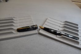 A Conway Stewart 85 leverfil fountain pen in grey marble with single narrow band to the cap having a