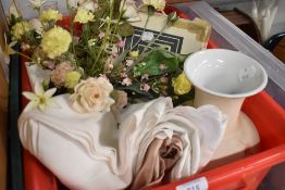 A selection of ceramics and false flowers