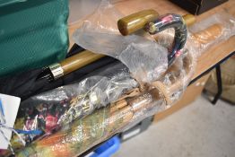 Five modern umbrellas including cane and stick handles