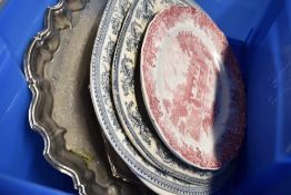A selection of ceramic trays and similar metal examples