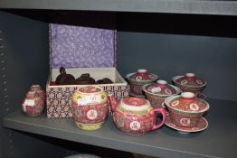 A cased Chinese Zisha tea set and similar Cantonese styled set