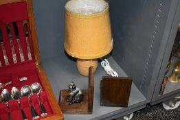 A modern Cumbrian studio pottery table lamp with mustard coloured shade, together with a pair of oak