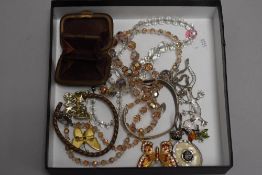 A small selection of costume jewellery including crystal beads, brooches, bangles and small