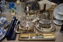 A good collection of silver plated table wares including cut glass ewer, gallery trays and Royal