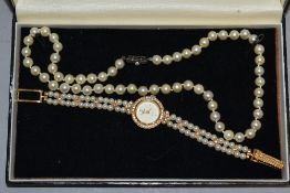 A cultured pearl necklace of even knotted form having a silver clasp, approx 18' and a fashion dress