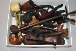 A good collection of tobacco smokers pipes including burr woods, Sterling silver banded and carved