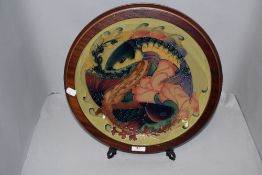 A Moorcroft Pottery 'Quiet Waters' pattern charger, designed by Philip Gibson and tube lined with