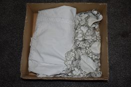 An early 20th century cotton single bed throw with crochet edging, sold together with some