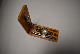 A set of 20th century wooden cased travelling scales, retaining four weights