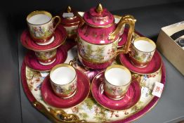 A Vienna porcelain figural, puce and gilt decorated coffee set, comprising coffee pot, sucrier,
