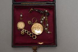 A small selection of vintage jewellery including JF Kennedy pendant, rolled gold locket, cut