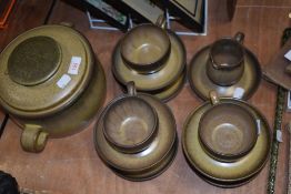 A set of six tea cups by Denby with milk jug and lidded crock pot