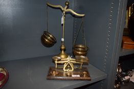 A set of 20th century brass and mahogany postal scales, together with a set of brass beam scales.