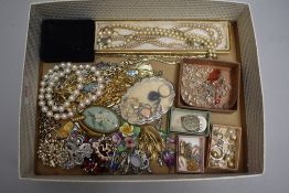 A selection of costume jewellery including brooches, earrings, chains etc