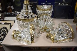 Four mirrored ormalu and mirror backed wall lights with glass lustre drops and a similar pendant