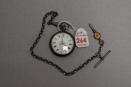 A small Victorian silver key wound pocket watch having Roman numeral dial with subsidiary seconds to