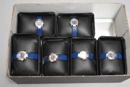 Six boxed ladies Cosmopolitan wrist watches, all same design with blue straps