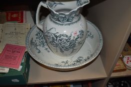 A matching wash jug and bowl set by Maple and Co Tottenham court London in the Carnation design