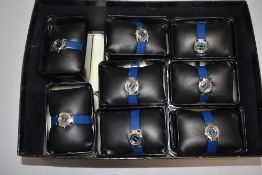 Eight boxed ladies Cosmopolitan wrist watches, all same design with blue straps