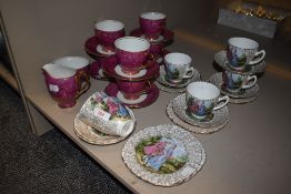 Two part tea services including Polish pink lustre glaze and Fragonard