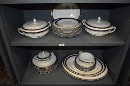 A large part dinner service by Alfred Meakin in the Bleu de Roy design