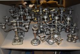A good collection of various design multi branch silver plated candle sticks or stems
