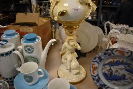 An impressive late Victorian centre piece porcelain oil lamp, having mythical fish with cherub rider