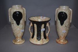 A Carstens (West German) two-handled flared cylindrical vase, decorated with marbled orange/cream