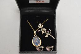 A faux black opal pendant having a gold plated mount stamped SIL/925 on a gold plated chain, a