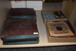 A collection of shellac 78rpm records and brochures for Colombia and Edison Bell