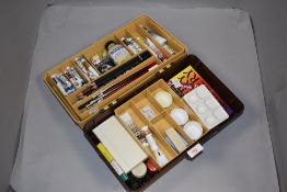 A selection of artist supplies mostly oil paints etc
