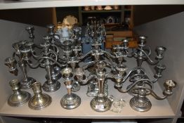 Approximately six pairs of multi branch candle sticks or stems in plated silver designs