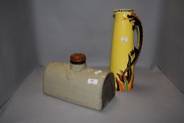 A dragon handle Oriental ivory water jug by Bishop and a stone ware footwarmer