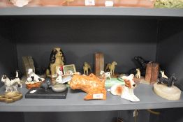 A selection of Austrian cold-painted metal dog and stone bookends, ashtrays and a selection of other
