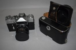 A Zenit E SLR camera with 58mm lens in original cover