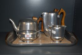 A 1960's Piquot Ware Aluminium five-piece teaset, comprising teapot, hot water pot, sugar, cream and