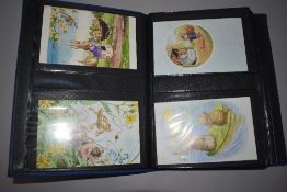 A binder of illustrated cartoon style postcards including Mabel Lucie Attwell and similar