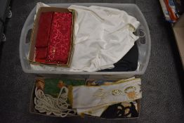 A selection of Church or England or Roman Catholic vestments or choir dress including woven silks