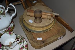 A good collection of treen wood and kitchen items including bread boards and utensils
