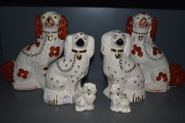 Three pairs of graduated Staffordshire dogs or spaniels
